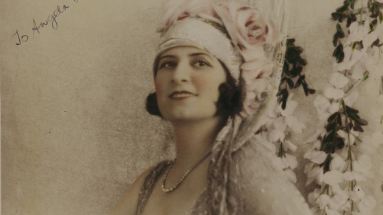A hand-coloured photo of Gladys Moncrieff