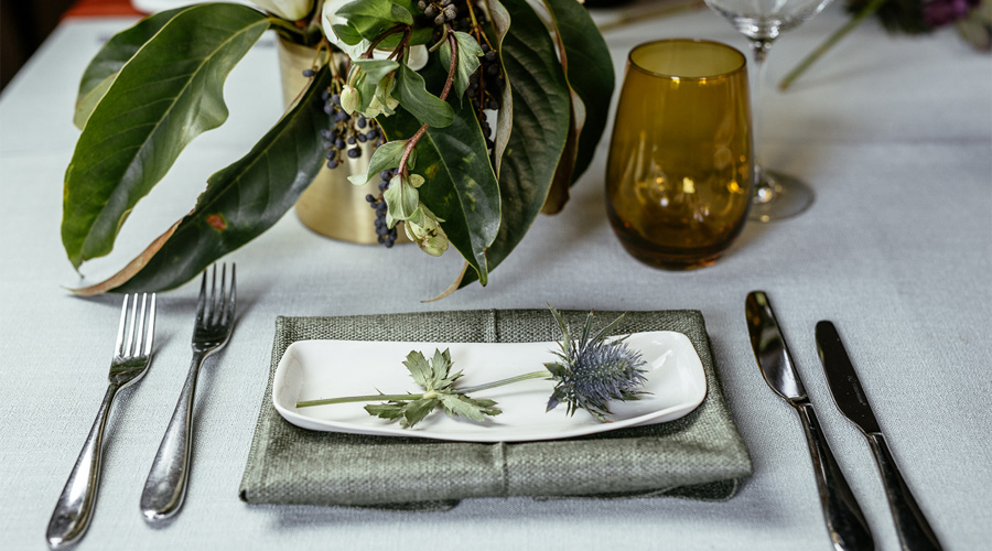 A place setting in orange and green